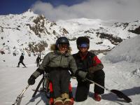 A dual ski is a sit ski with two skis under a seat, used in adaptive snow sports